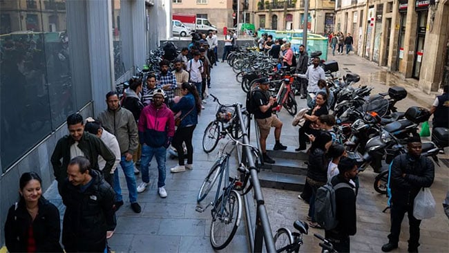 Spain starts program to legalize up to half-million migrants